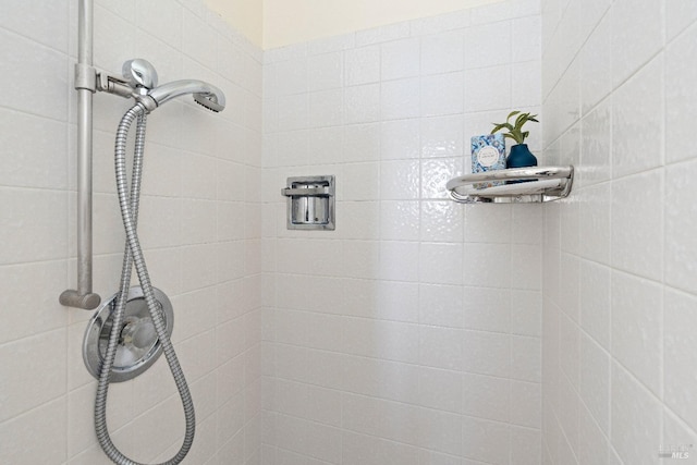 bathroom with a tile shower