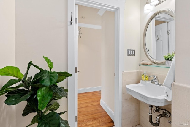 bathroom featuring wood finished floors and baseboards