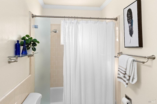 bathroom featuring shower / bath combination with curtain, toilet, and crown molding