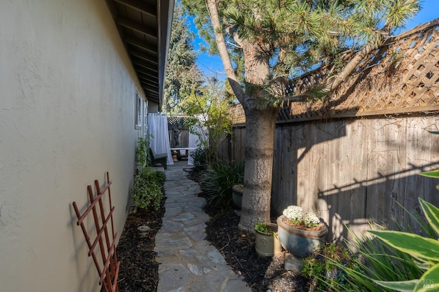 view of home's exterior featuring fence and stucco siding