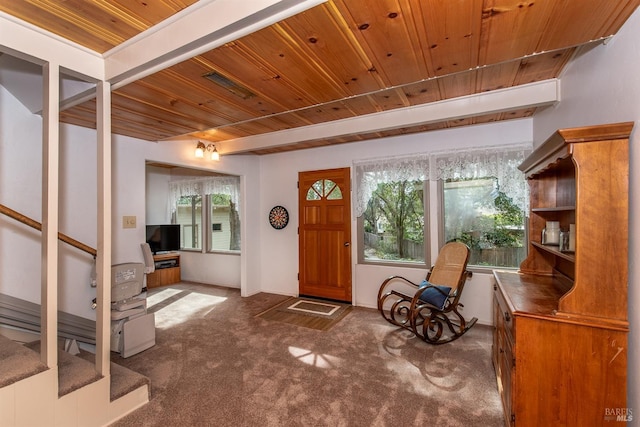 carpeted entryway featuring wooden ceiling and visible vents