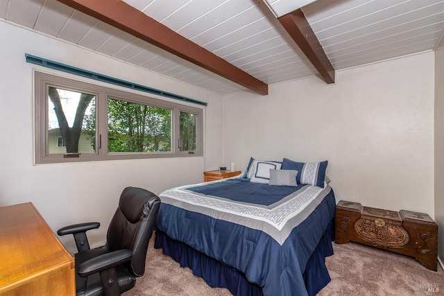 carpeted bedroom with wood ceiling and beam ceiling