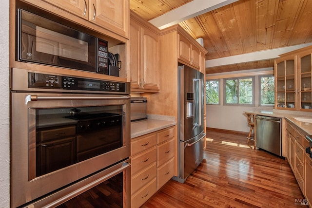 kitchen featuring glass insert cabinets, wood ceiling, appliances with stainless steel finishes, and light countertops