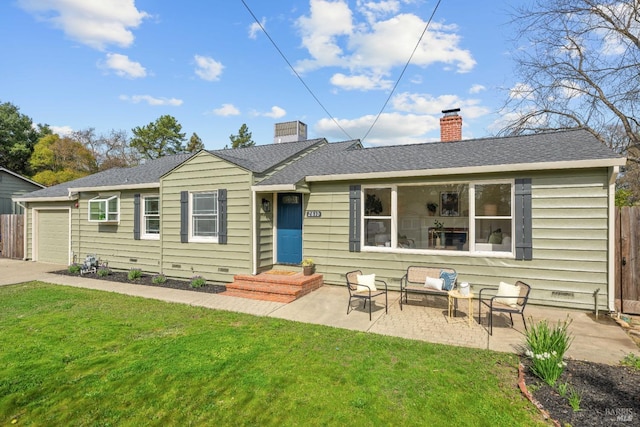 view of front of house with roof with shingles, a chimney, an attached garage, fence, and a front lawn