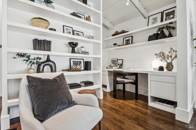 home office featuring dark wood-style floors, built in desk, built in shelves, and vaulted ceiling with beams