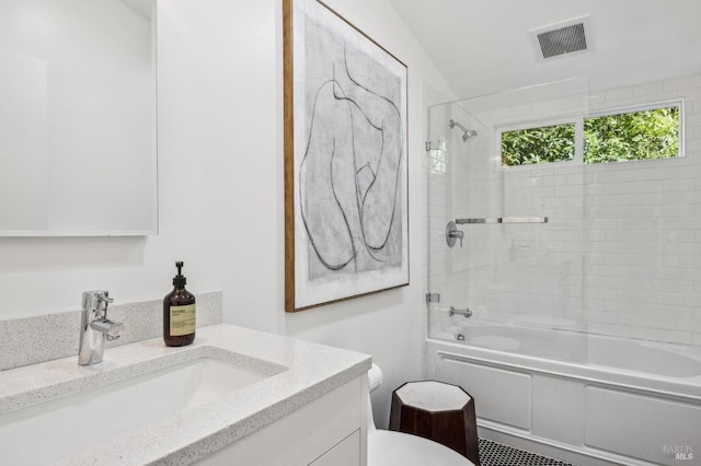 full bath with shower / bath combination, visible vents, vanity, and toilet