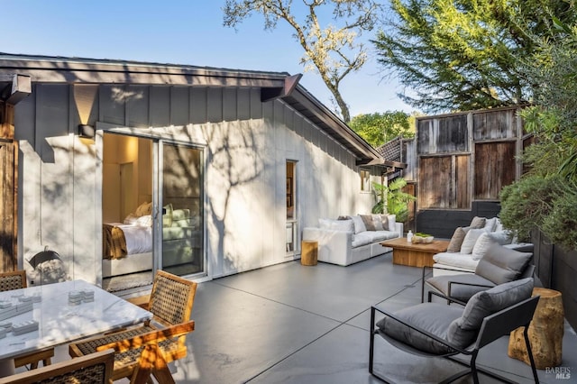 view of patio / terrace with outdoor dining space, outdoor lounge area, and fence