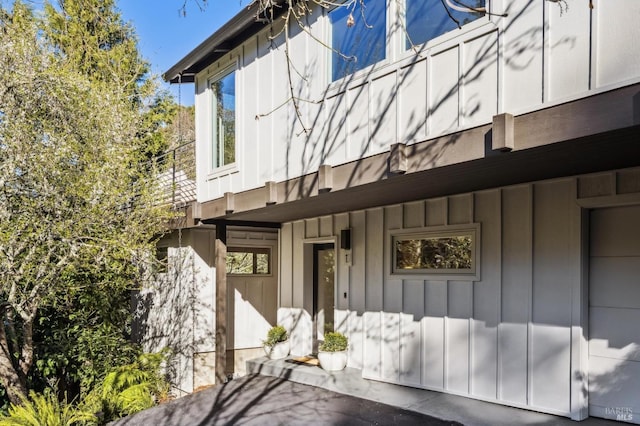 entrance to property featuring board and batten siding