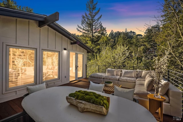 deck with outdoor lounge area and french doors