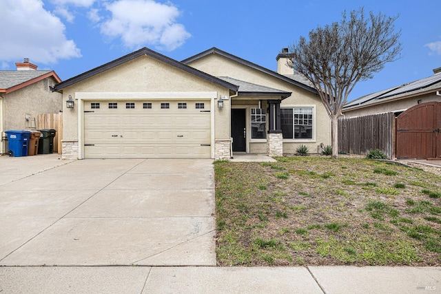 ranch-style home featuring a garage, driveway, fence, and stucco siding