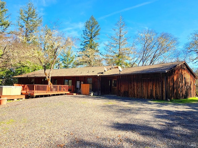 view of front of house featuring a wooden deck