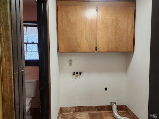washroom featuring cabinet space and electric dryer hookup