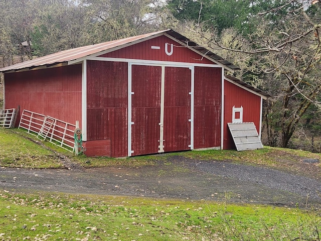 view of pole building featuring a wooded view