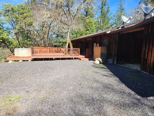 view of side of property with a deck