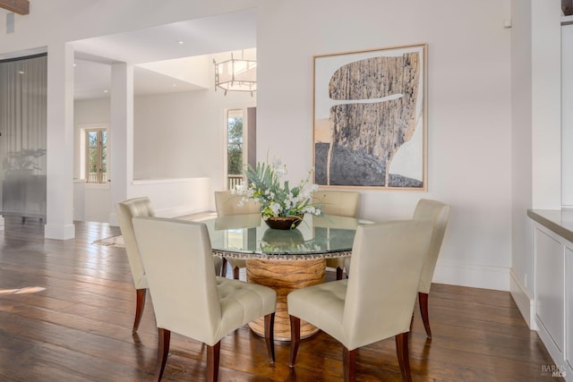 dining room with recessed lighting, baseboards, and wood-type flooring