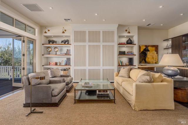 living room featuring visible vents, recessed lighting, and built in features