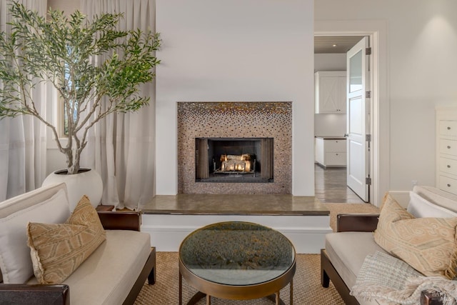 living area with a lit fireplace