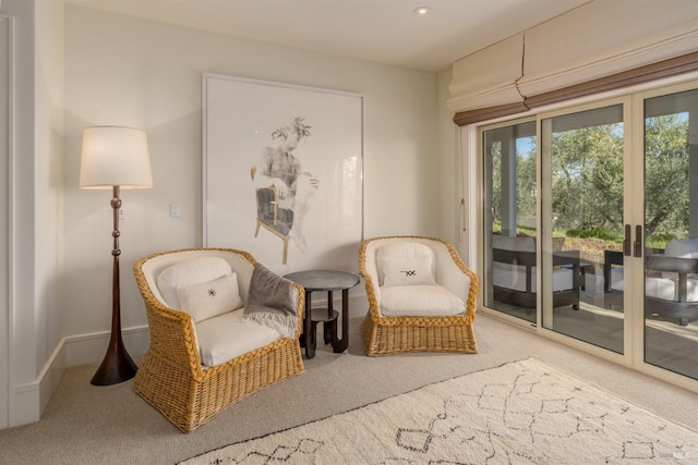 sitting room with recessed lighting, baseboards, and carpet flooring