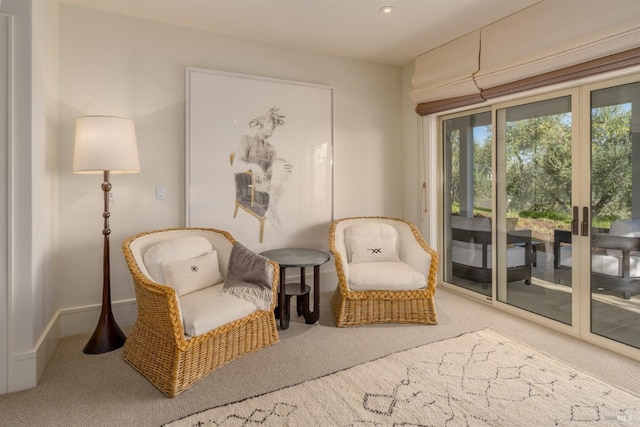 living area featuring recessed lighting, carpet floors, and baseboards