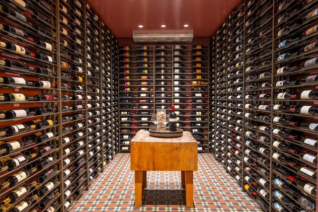 wine room featuring electric panel and recessed lighting
