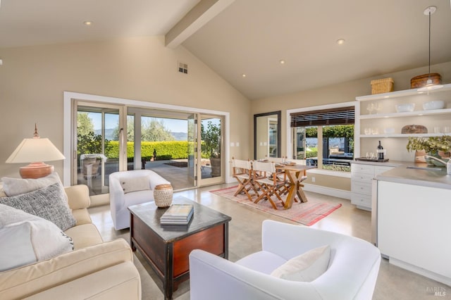 living area with recessed lighting, visible vents, beam ceiling, and high vaulted ceiling