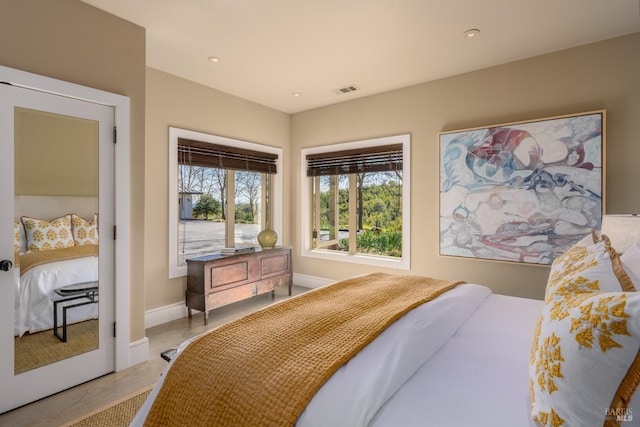 bedroom featuring visible vents, baseboards, and recessed lighting