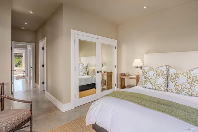 bedroom featuring recessed lighting, french doors, baseboards, and finished concrete flooring