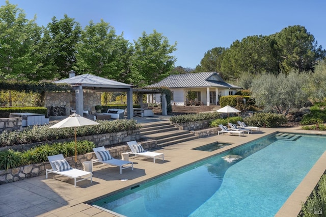 pool featuring a patio area