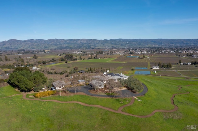 drone / aerial view featuring a rural view and a mountain view