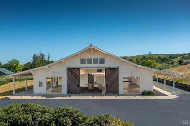 back of property with an outdoor structure