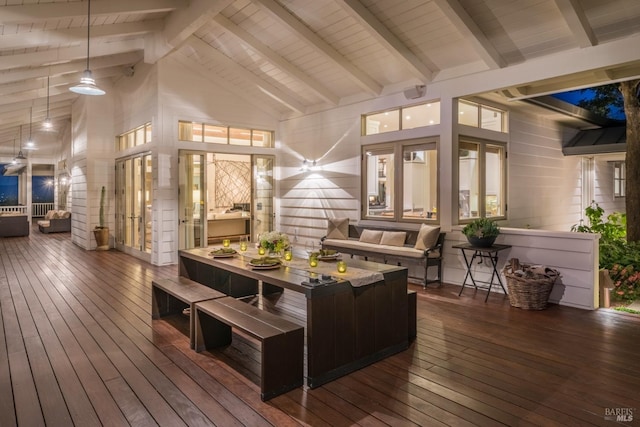 sunroom / solarium featuring beam ceiling