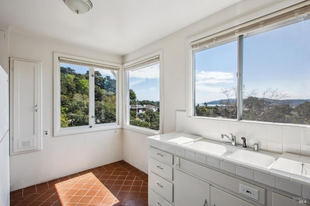 bathroom featuring tile patterned floors and a sink