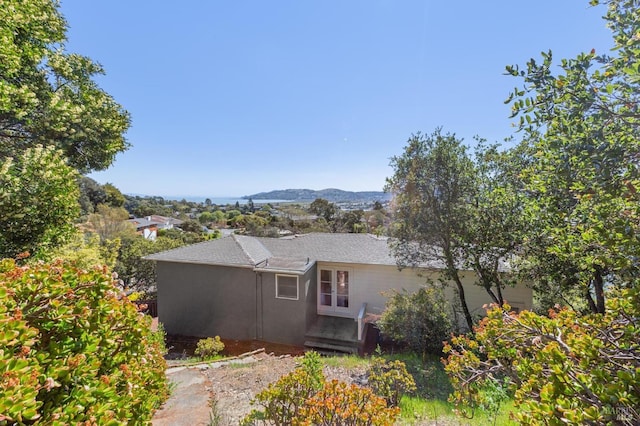 view of home's exterior with a mountain view