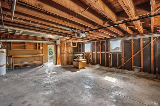 interior space featuring gas water heater and a garage door opener