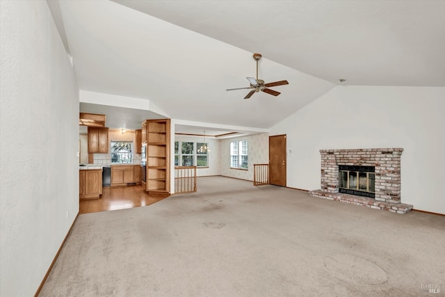 unfurnished living room with light carpet, baseboards, ceiling fan, vaulted ceiling, and a brick fireplace