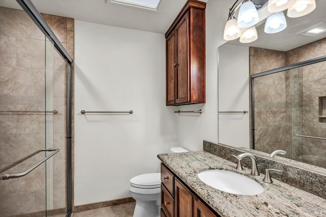 full bathroom with toilet, a stall shower, and vanity