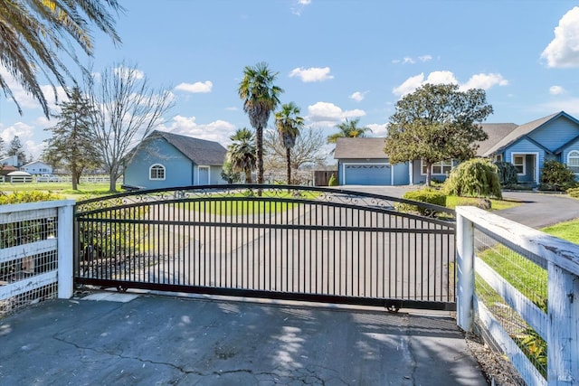 view of gate featuring a residential view