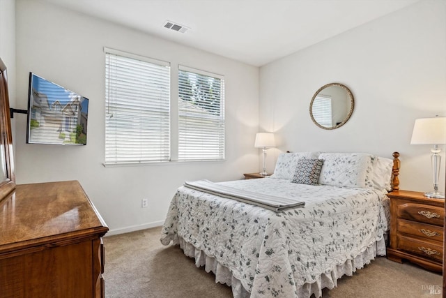 bedroom featuring carpet floors, baseboards, and visible vents