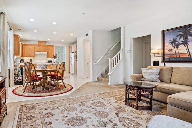 living area with recessed lighting, visible vents, stairway, and baseboards