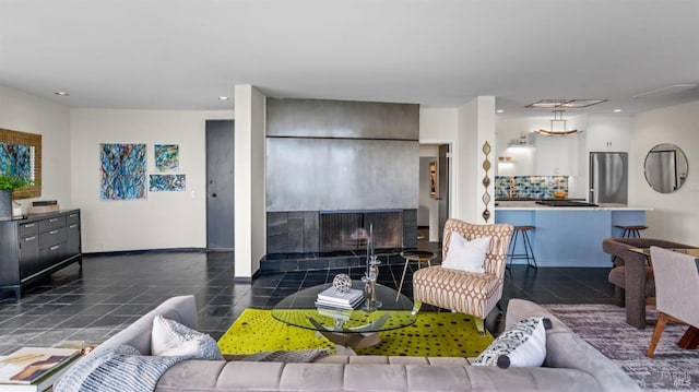 living area with baseboards, tile patterned flooring, and recessed lighting