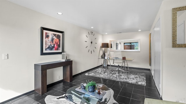 tiled living room with recessed lighting and baseboards