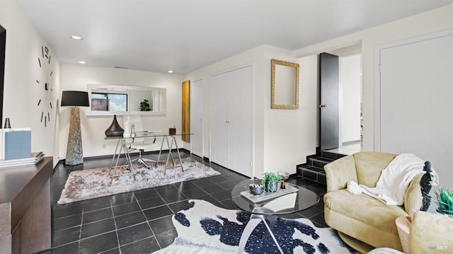 tiled living area featuring recessed lighting