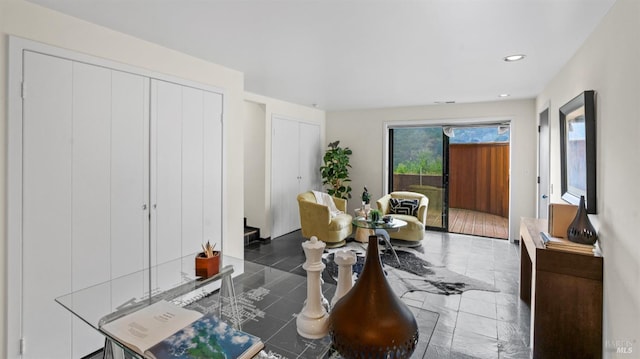 tiled dining room featuring recessed lighting