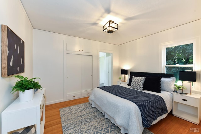 bedroom with light wood finished floors