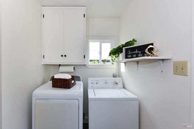 laundry area with washing machine and dryer and cabinet space