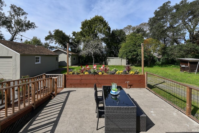 view of patio featuring a shed and an outdoor structure