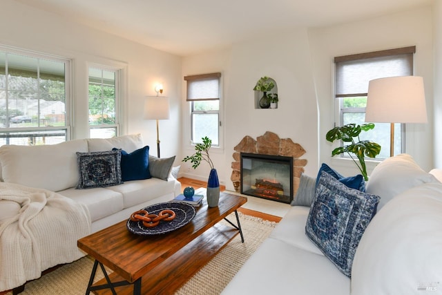 living room with a healthy amount of sunlight and a fireplace