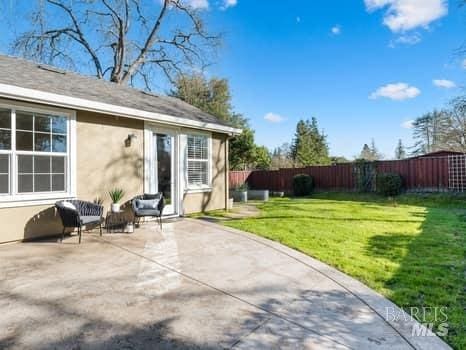 exterior space with a patio area and fence