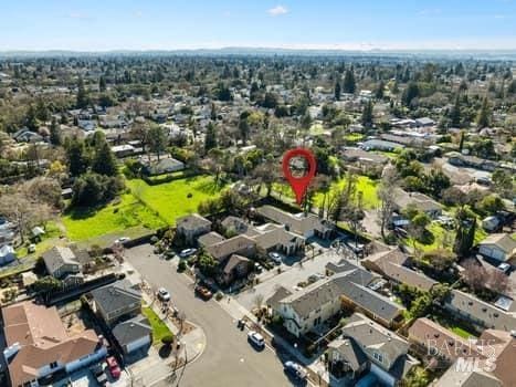 birds eye view of property with a residential view