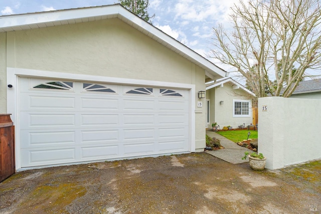 garage featuring driveway